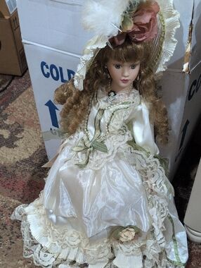 Victorian-Style Porcelain Doll in Ivory Dress with Green Accents